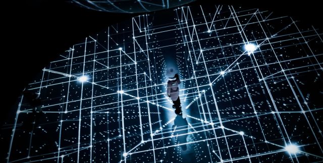Person standing in the middle of a virtual grid, symbolizing innovation.